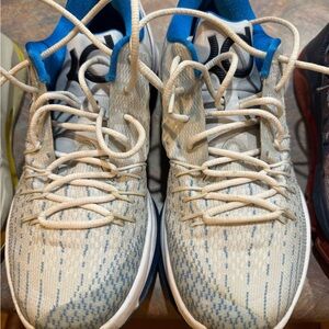 Nike Cream and Blue Athletic Shoes with Woven Design